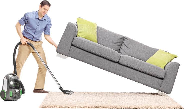 photo of a cleaner lifting a sofa to clean under