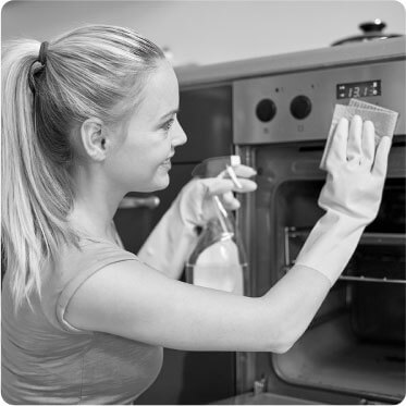 photo of a female cleaner putting on gloves