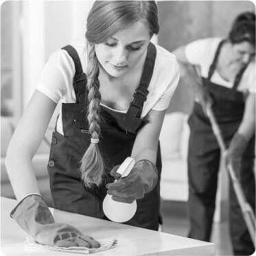 photo of two female cleaners doing work