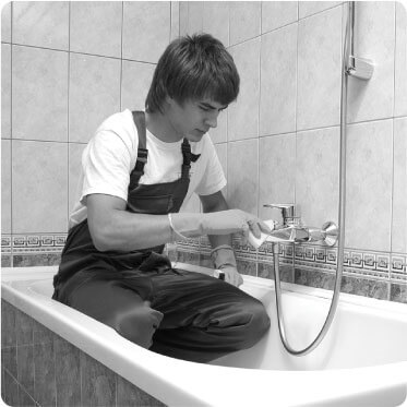 photo of a cleaner cleaning a bathroom