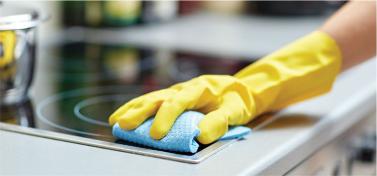 image of a cleaner cleaning an oven