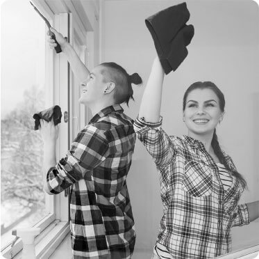 photo of a cleaner cleaning a window