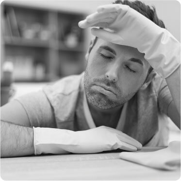 image of a tired hard working cleaner taking a break