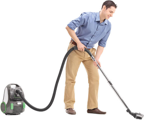 a cleaner cleaning the floor with a vacuum cleaner