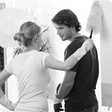 photo of two cleaner talking to each other while doing work